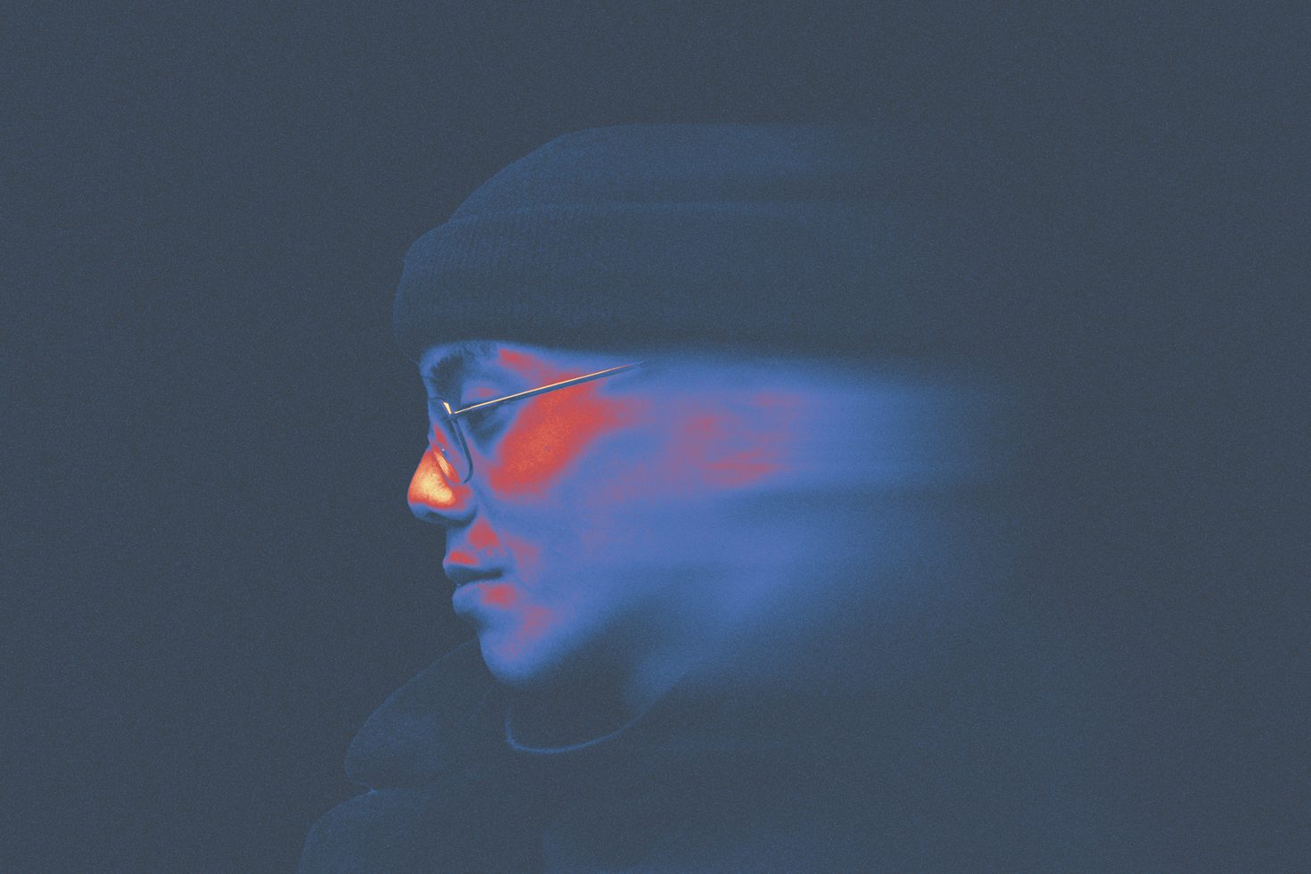 Side profile of a person with a neon blue and red duotone effect, wearing glasses and a beanie, ideal for graphics and art templates.