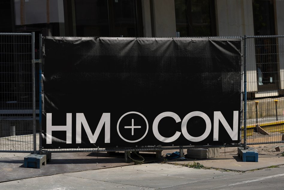 Outdoor banner mockup on construction site fence, versatile for designers to display logo or branding designs in a realistic setting.