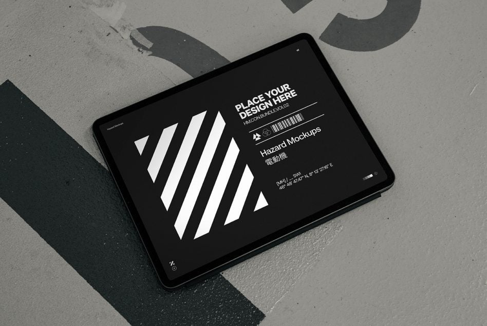 Black tablet screen showing white diagonal stripes on concrete surface