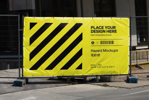 Yellow construction hazard mockup banner with customizable design space, urban setting, for graphic design and template display.