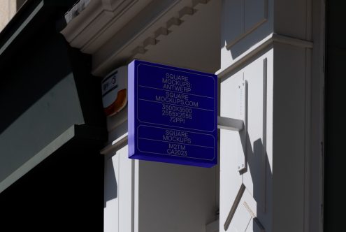 Bright blue square sign mockup on contemporary architecture facade