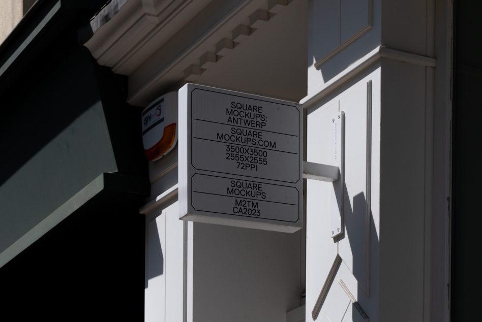 Dark gray square signage mockup mounted on modern building exterior