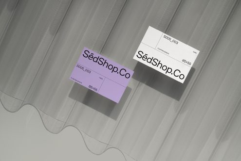 Purple plus cream colored business cards with SedShop.Co branding displayed