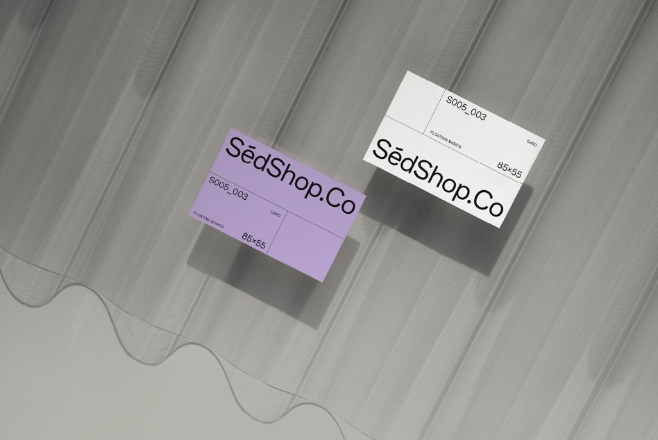 Purple plus cream colored business cards with SedShop.Co branding displayed