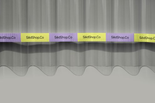 Corrugated metal backdrop with alternating purple, yellow, plus white branded ribbon labels