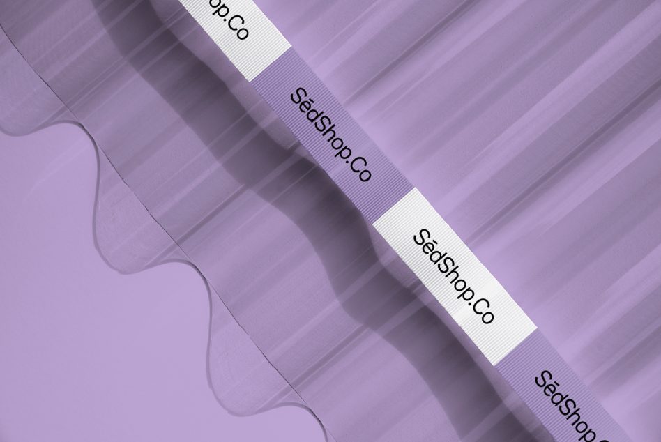 Multiple fabric ribbons stacked diagonally with SedShop.Co branding on purple