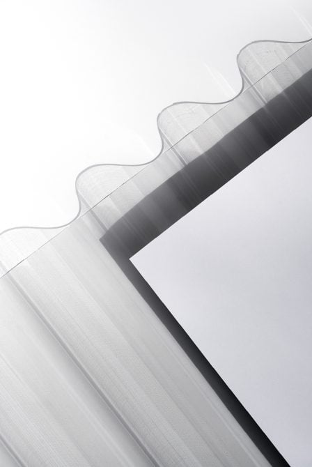 Minimalist box mockup detail shot with dark stripe on light background
