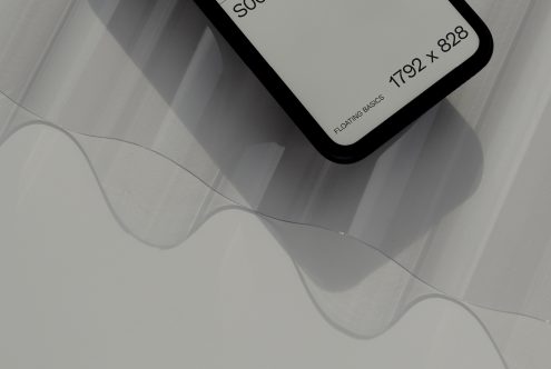 Close-up iPhone mockup showing product specs on striped background