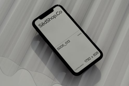iPhone mockup displaying SédShop.Co branding on lined gray background