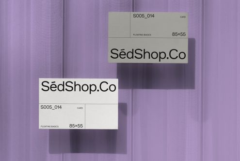 Two business card mockups displaying SédShop.Co design in different angles