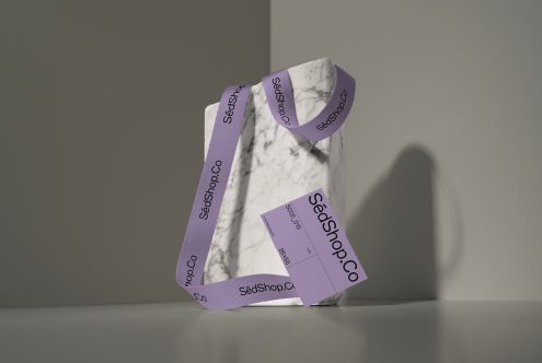Marble box wrapped in purple branded ribbon with SedShop.Co business card attached