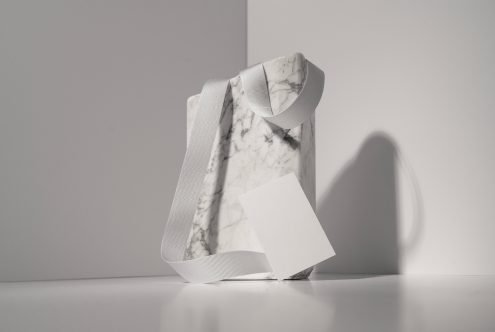 White marble package with grooved ribbon strap showing minimalist SedShop.Co design