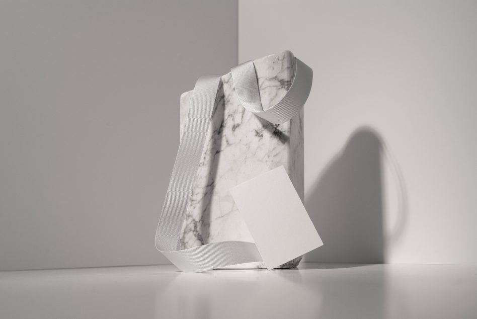 White marble package with grooved ribbon strap showing minimalist SedShop.Co design