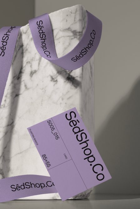 Marble textured product with purple ribbed ribbon featuring SedShop.Co branding