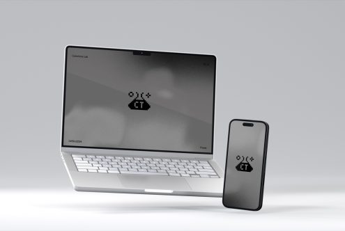 Silver laptop next to smartphone both showing pixelated cloud icon on screen