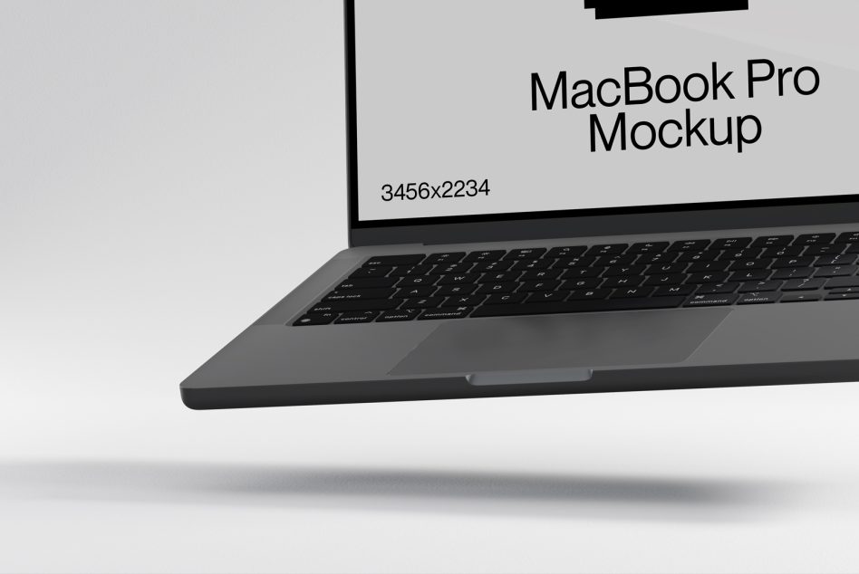MacBook Pro angled view showing keyboard on light gray surface