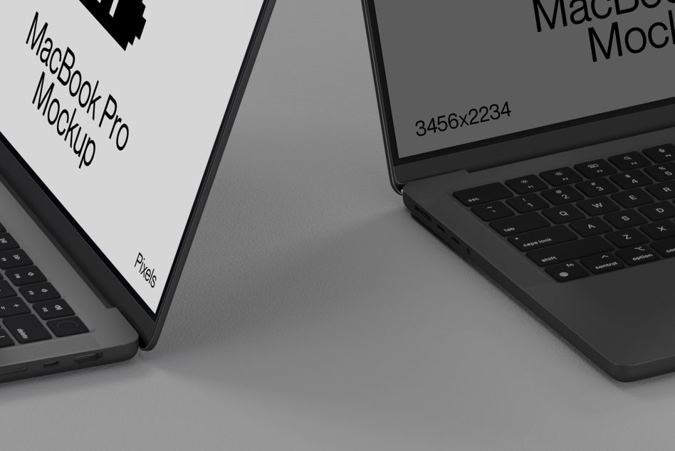 Two MacBook Pro laptops side by side showing gray screen mockups with text overlay