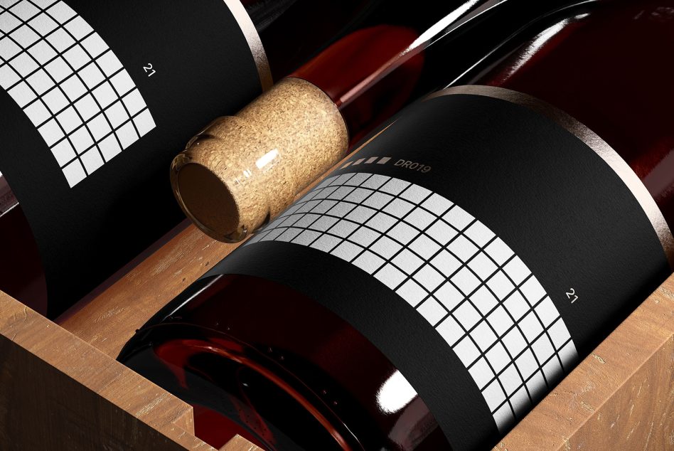 Wine bottle mockup with elegant label design, showcasing cork detail, on a wooden surface for product presentation.