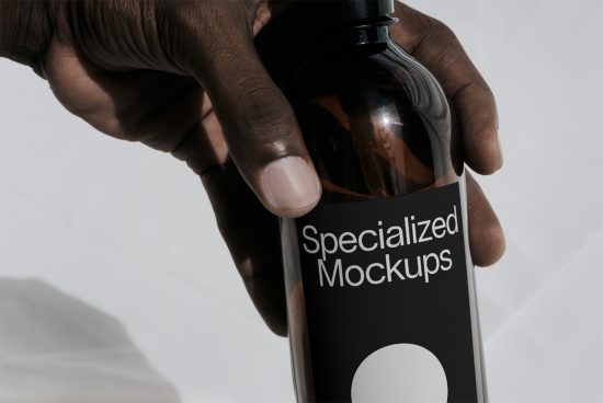 Person holding a bottle with a label reading Specialized Mockups, ideal for product packaging presentations in mockup category.