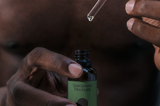 Close-up of a person using a dropper with a mockup bottle labeled Specialized Mockups for product design, packaging, and branding materials.
