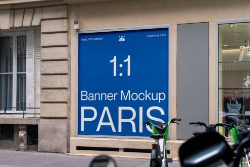 Blue square banner mockup 1:1 on Paris storefront with green bikes