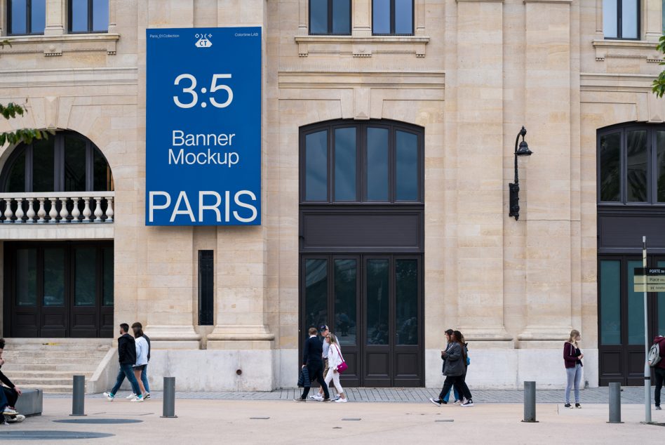 Vertical blue banner with white text hanging on Haussmann building in Paris courtyard