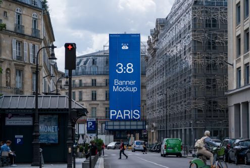Blue vertical banner on Paris avenue, 3:8 ratio, crowded urban setting