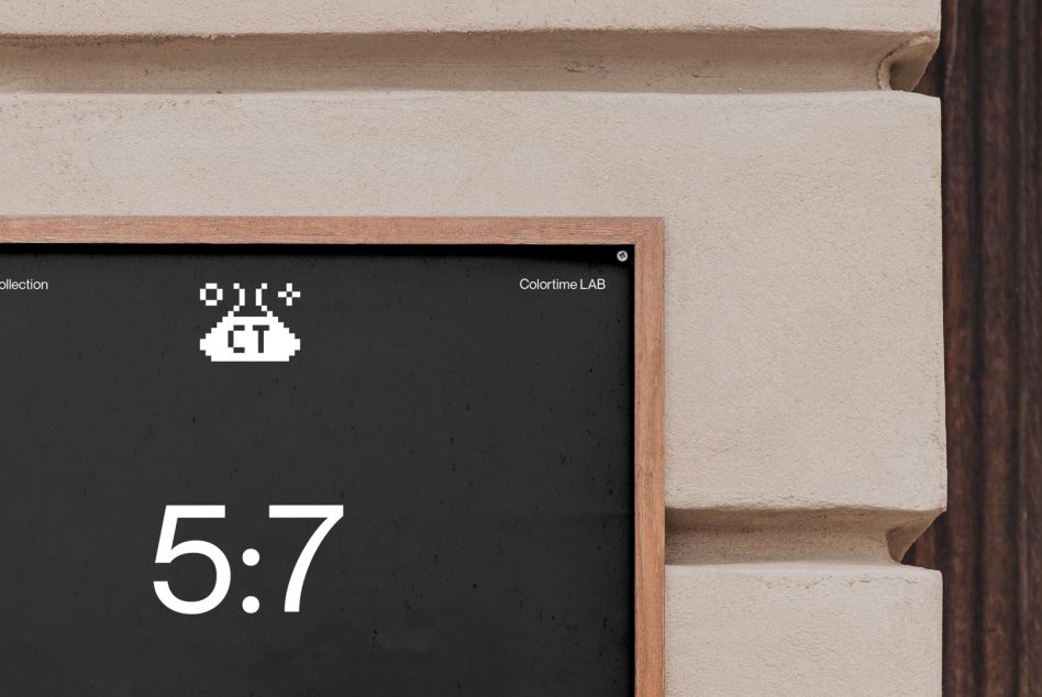 Dark framed poster mockup in wood frame against cream wall section