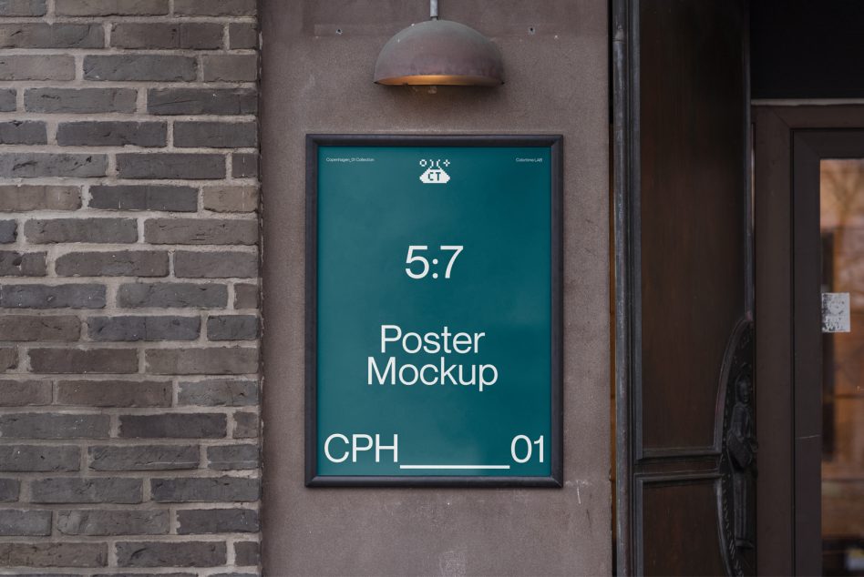 Framed poster mockup on dark brick wall with dome lamp, teal background