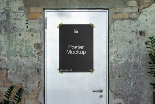 A2 poster frame with dark background taped to vintage door with green patina
