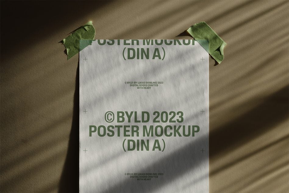 DIN A poster mockup with white paper held by green tape on beige background