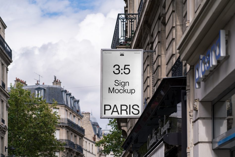 Vertical white sign hanging from Paris storefront with 3.5 ratio format
