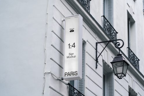 White vertical banner displaying 1:4 ratio mockup on classical building