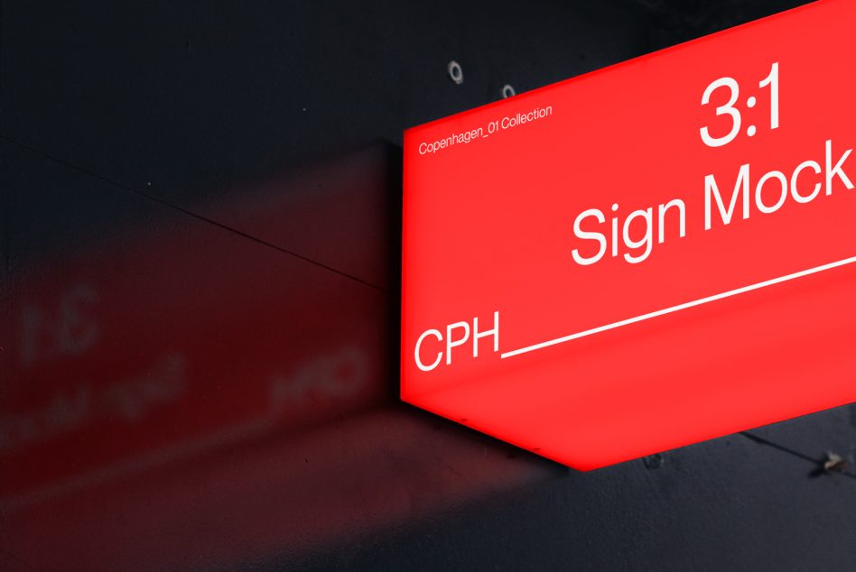 Bright red 3:1 sign mockup glowing on dark industrial building exterior