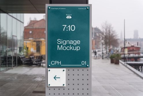 Teal 7:10 signage mockup with white text on urban storefront with pedestrians