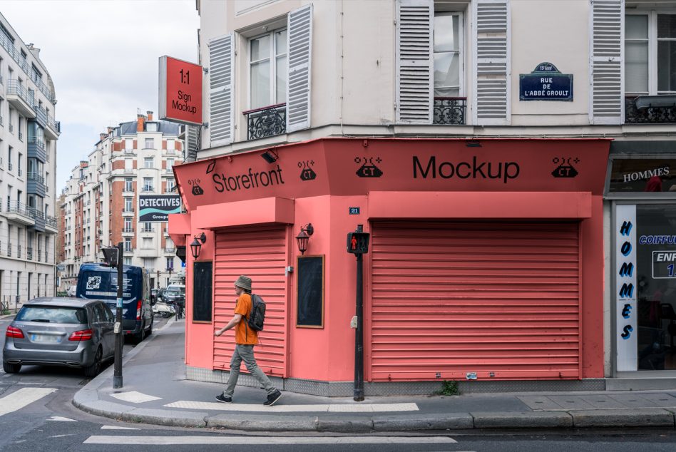 Red storefront with matching square sign above entrance on Paris street