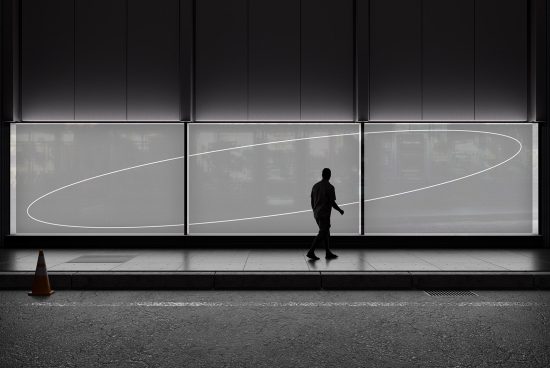 Silhouetted person walking by modern billboard mockup with clear space for design at night, urban outdoor advertising display template.