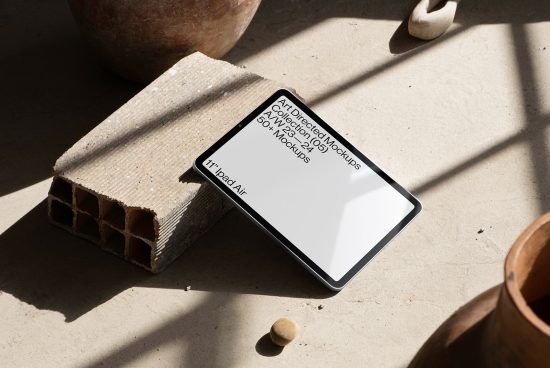 Tablet mockup on concrete with shadows, modern design presentation, digital asset for creative designers, real-world scene, high-resolution.