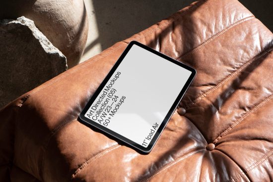 Tablet mockup resting on a leather cushion showcasing screen for design presentation, digital mockups category, perfect for portfolio display.