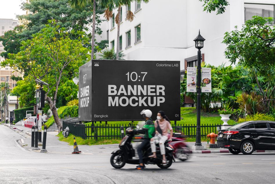 Outdoor banner mockup on city street with tropical trees, vehicles, pedestrians for graphic design showcase, advertising presentation, urban mockups.