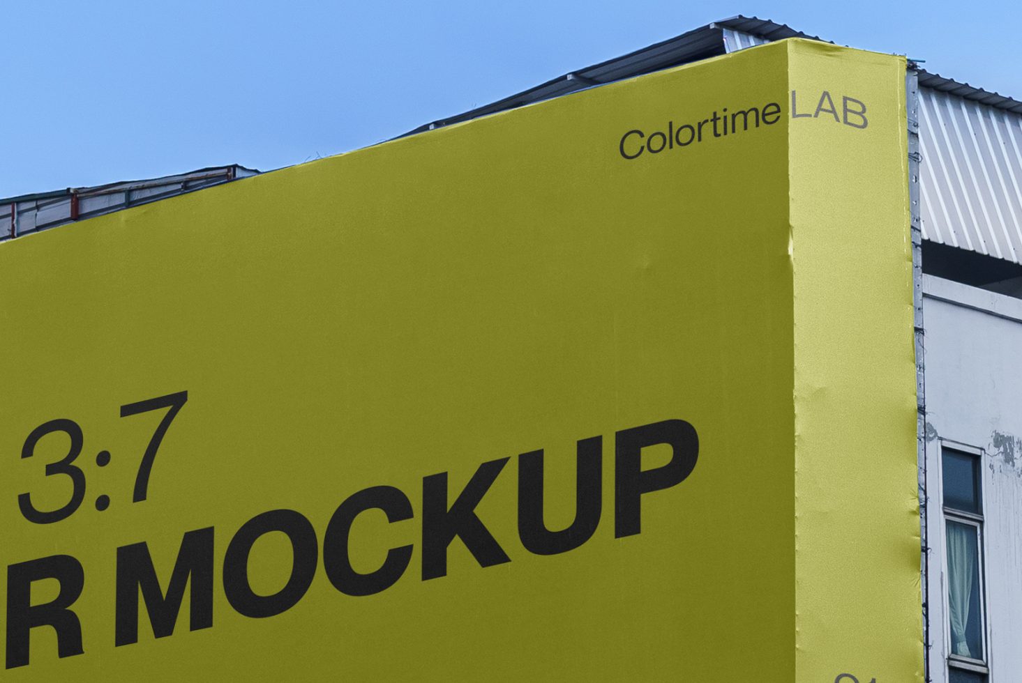 Bright yellow billboard mockup by Colortime LAB on a building, clear sky, visible design space for graphic designers' advertising projects.