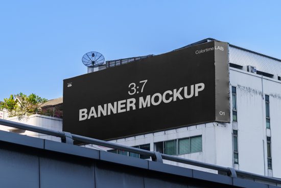 Outdoor billboard banner mockup on building facade, clear sky backdrop, ideal for advertising design presentations.