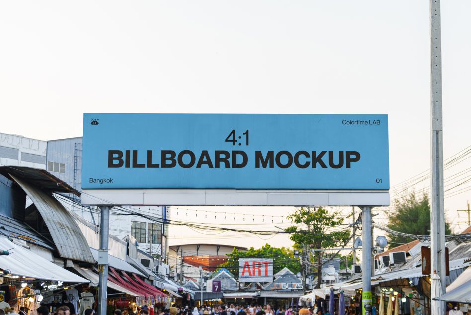Blue billboard with dark text over Bangkok street market with stalls below