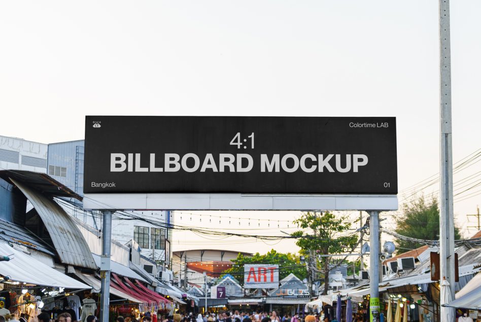 Dark billboard with white text spanning above busy Bangkok market crowd