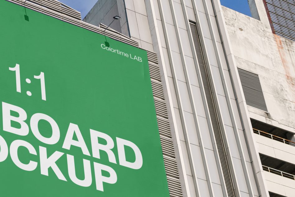 Close-up of bright green building-mounted board with white text reading 1:1 board mockup, modern architecture