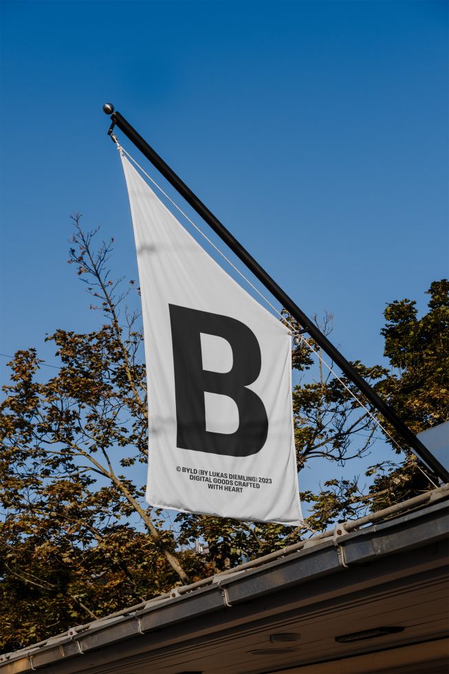 White flag mockup with bold black letter B hanging outdoors, clear blue sky background, template design, graphic display, branding asset.