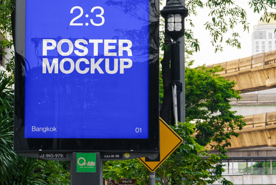 Outdoor urban poster mockup on a billboard in Bangkok for advertising design presentation, surrounded by lush greenery and city elements.