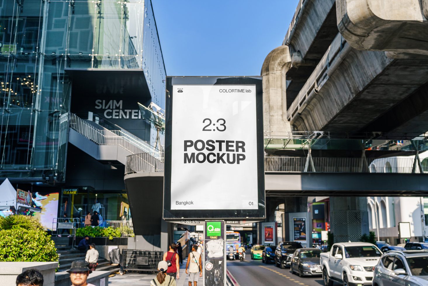 Urban billboard poster mockup in a busy city street setting with clear sky, ideal for design presentations and advertising visuals.