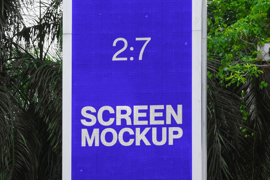 Outdoor advertising screen mockup in a natural setting with foliage background for billboard design presentation.