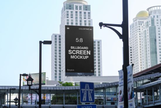Urban billboard mockup on a high-rise building for outdoor advertising in front of a blue sky, suitable for designers to showcase work.